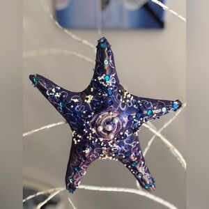 Purple starfish hanging decoration .